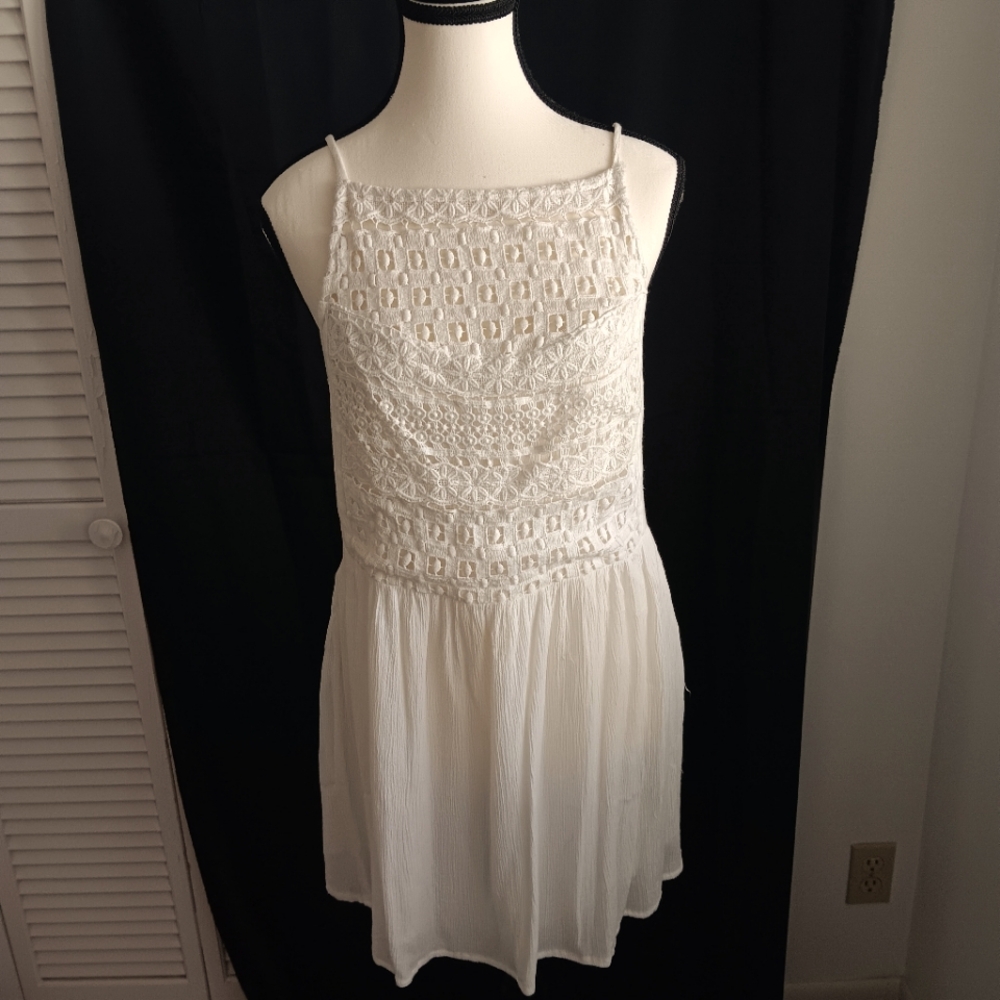 Roxy eggshell color dress with crochet bib on front .Tone on tone color bib.